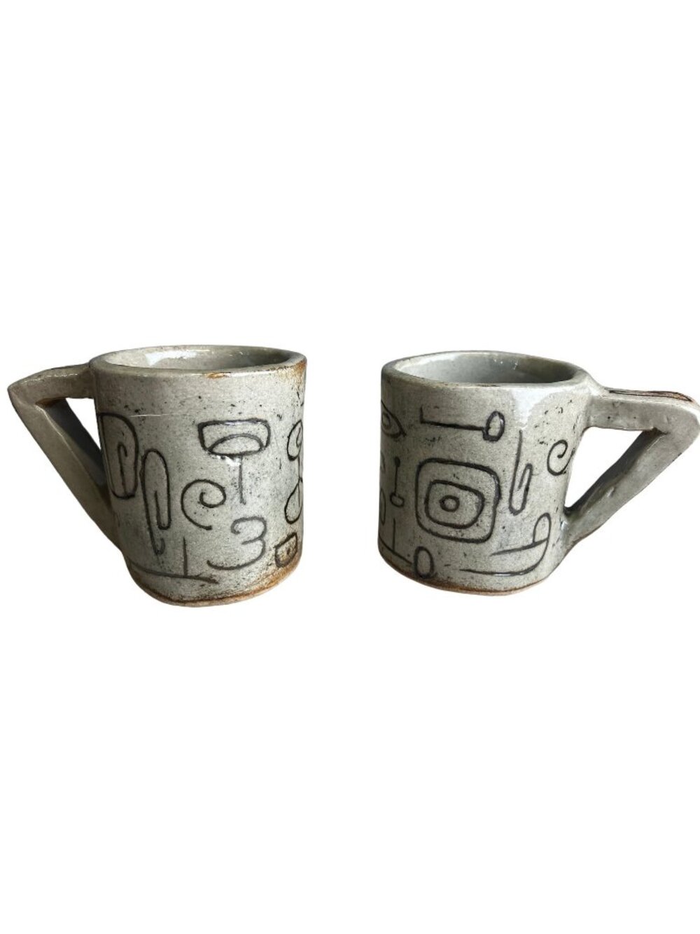 Pair of Hand-formed Mugs with Branding Iron Designs Angular Handles Beige